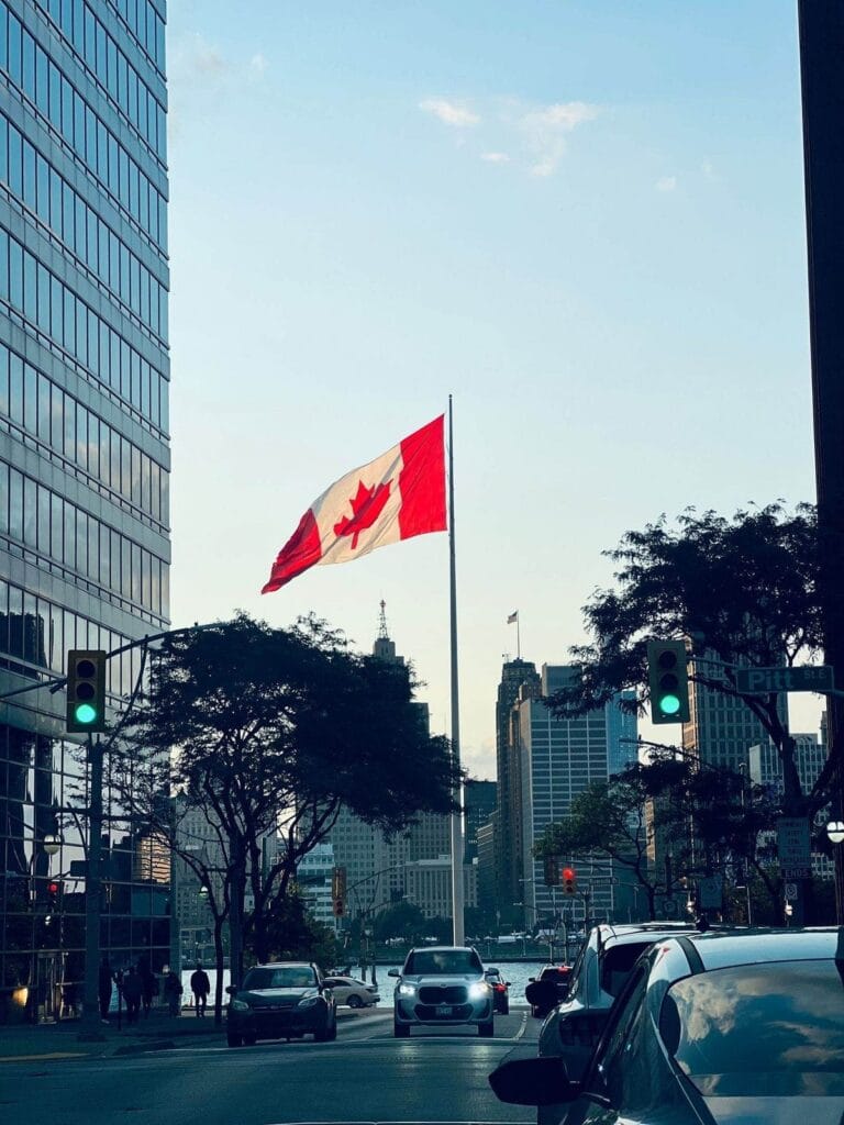 Canadian flag flying in downtown Windsor, Ontario, part of the Kratom Delivery Canada delivery area